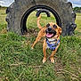 Penny is registered to the contest to win money with this photo: dog, happy, outdoor, grass, field, tire, animal, pet, canine, playful, nature, sky, cloudy, harness, tail, mouth_open, tongue_out, small_dog, brown_dog, vibrant