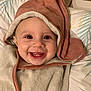 Thalya participe au concours pour gagner de l'argent avec cette photo : baby, blanket, child, cozy, cute, eyes, face, happy, head, hood, indoor, infant, lying_down, pillow, portrait, skin, smile, teeth, towel, warm