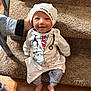 Satori joined the competition — help win amazing prizes! baby, child, smiling, hat, doctor_outfit, carpet, stairs, hand, striped_pants, cute, indoors, person, infant, happy, clothing, footwearless, portrait, sitting, young_child, human