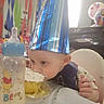 Jason joined the competition — help win amazing prizes! baby, cupcake, party_hat, birthday, milk_bottle, winnie_the_pooh, frosting, face, highchair, streamers, balloons, table, celebration, child, food, smash_cake, indoor, person, festive, colorful