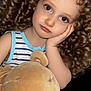 Florina a rejoint le concours — aidez-le/la à gagner de superbes lots ! brown_eyes, casual_wear, child, closeup, comfortable, curly_hair, cute, indoor, light_skin, long_hair, person, plush_toy, portrait, resting_head, sitting, soft_toy, striped_clothing, thoughtful, toddler, young_child