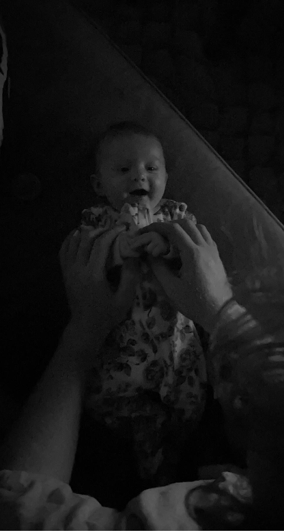 Lucille is registered to the contest to win money with this photo: arm, baby, black_and_white, darkness, finger, flash_photography, fun, gesture, hand, happy, jaw, monochrome_photography, mouth, nail, nose, person, standing, style, thumb, toddler