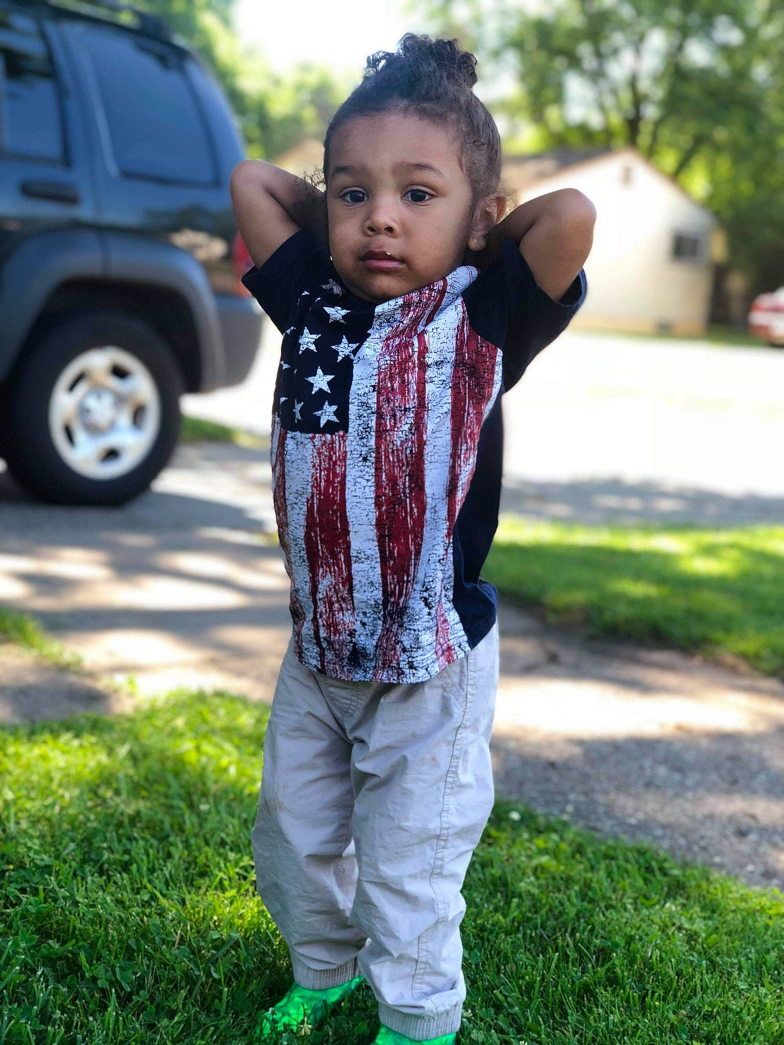 Izaiah is registered to the contest to win money with this photo: child, cool, grass, jeans, lawn, male, outerwear, people, person, photography, plant, shoe, toddler, tree