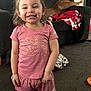 Journey joined the competition — help win amazing prizes! child, girl, smile, pink_clothing, indoor, carpet, sofa, dog, blanket, toy, happy, standing, casual_wear, living_room, earrings, shorts, tshirt, pet, home, relaxation