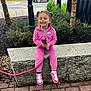 Journey is registered to the contest to win money with this photo: child, toddler, pink_tracksuit, nike, sneakers, smiling, closed_eyes, dog_leash, stone_bench, urban, greenery, trees, sidewalk, street, car, woman, casual, happy, outdoor, daytime