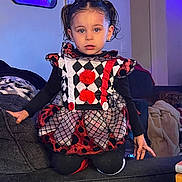 Journey joined the competition — help win amazing prizes! black_clothing, blanket, child, costume, couch, curious, decor, dog, dress, eyes, furniture, hair, harlequin, hat, home, indoor, pom_poms, portrait, red, sitting