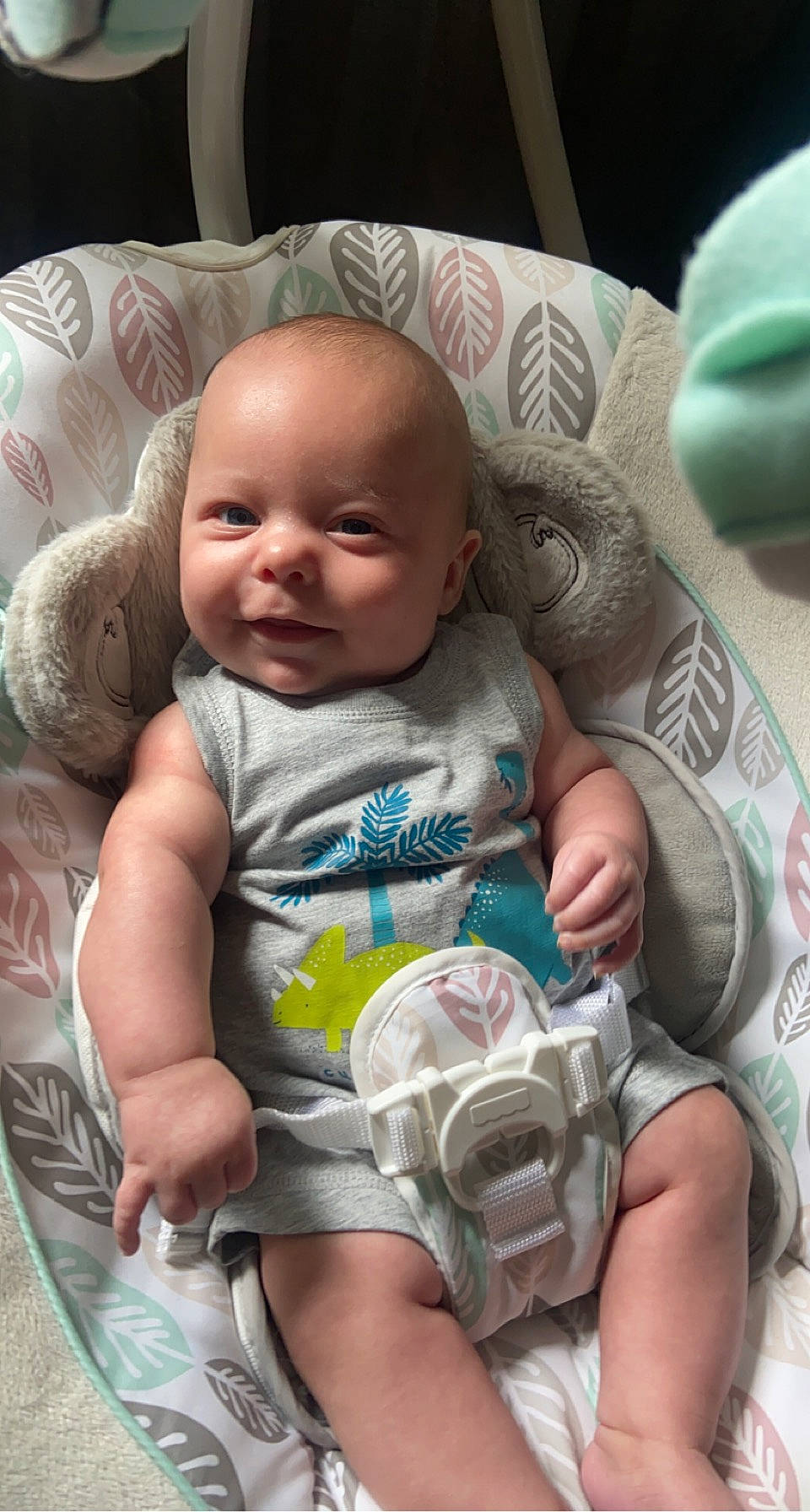 Baylor is registered to the contest to win money with this photo: arm, baby_toddler_clothing, cheek, chin, comfort, eye, face, green, head, human, leg, mouth, muscle, nose, organ, person, product, skin, smile, textile