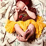 adorable, baby, blanket, bow, child, cozy, cute, face, feet, hands, headband, infant, maroon_outfit, newborn, person, resting, sleeping, soft, tutu, yellow_tutu