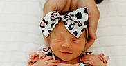 Lyla is registered to the contest to win money with this photo: baby, baby_girl, bow, child, closeup, cute, face, hands, headband, infant, newborn, newborn_baby, patterned, peaceful, pink_clothing, portrait, sleeping, smile, soft_light, toddler