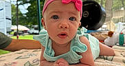 Lyla is registered to the contest to win money with this photo: baby, backyard, blanket, blue_outfit, canopy, child, floral_pattern, grill, hands, headband, infant, outdoor, pink_bow, portrait, sitting, smiling, summer, sunlight, tummy_time, wide_eyed