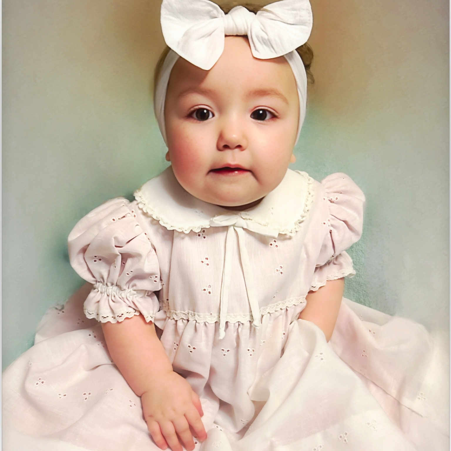 Frankie-Mae is registered to the contest to win money with this photo: accessories, baby, blouse, bonnet, clothing, costume, dress, eveningdress, face, fashion, formalwear, hat, head, headband, person, photography, portrait, sitting, sleeve, toy