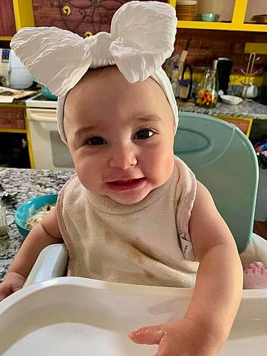 Amiri joined the competition — help win amazing prizes! baby, baby_toddler_clothing, cabinetry, child, costume_hat, event, fashion_accessory, fun, happy, headband, headpiece, holiday, person, product, room, sitting, sleeve, smile, t_shirt, toddler