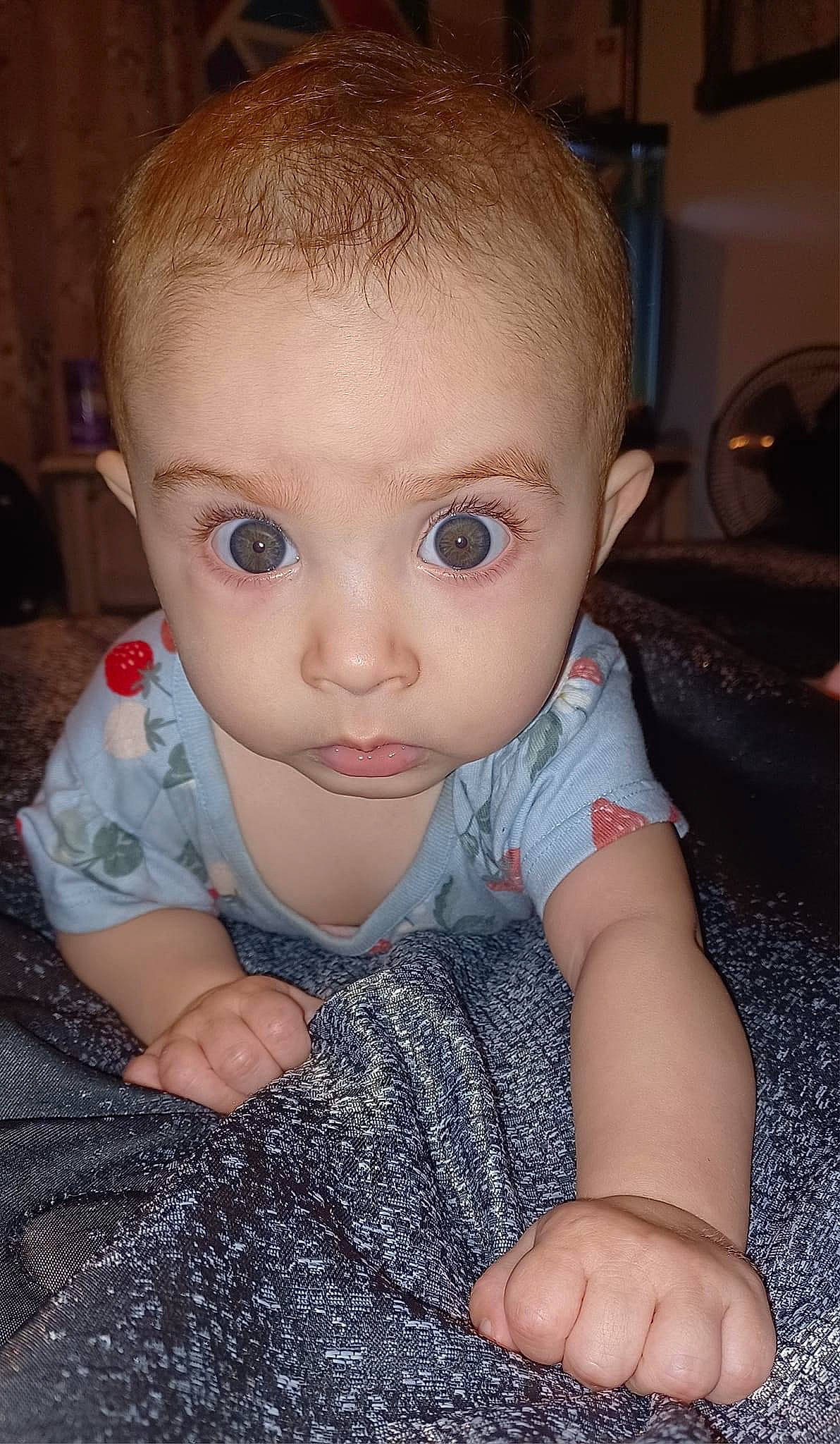 Amiri is registered to the contest to win money with this photo: baby, baby_toddler_clothing, cheek, child, chin, eyebrow, eyelash, finger, flooring, gesture, hand, iris, lip, mouth, nail, nose, person, skin, sleeve, thumb