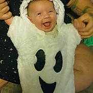 Braxton joined the competition — help win amazing prizes! baby, child, costume, ghost_costume, smile, happy, person, hood, tattoo, hand, cute, infant, face, clothing, white, black, fabric, indoor, holding, joy