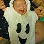 baby, child, costume, ghost_costume, smile, happy, person, hood, tattoo, hand, cute, infant, face, clothing, white, black, fabric, indoor, holding, joy