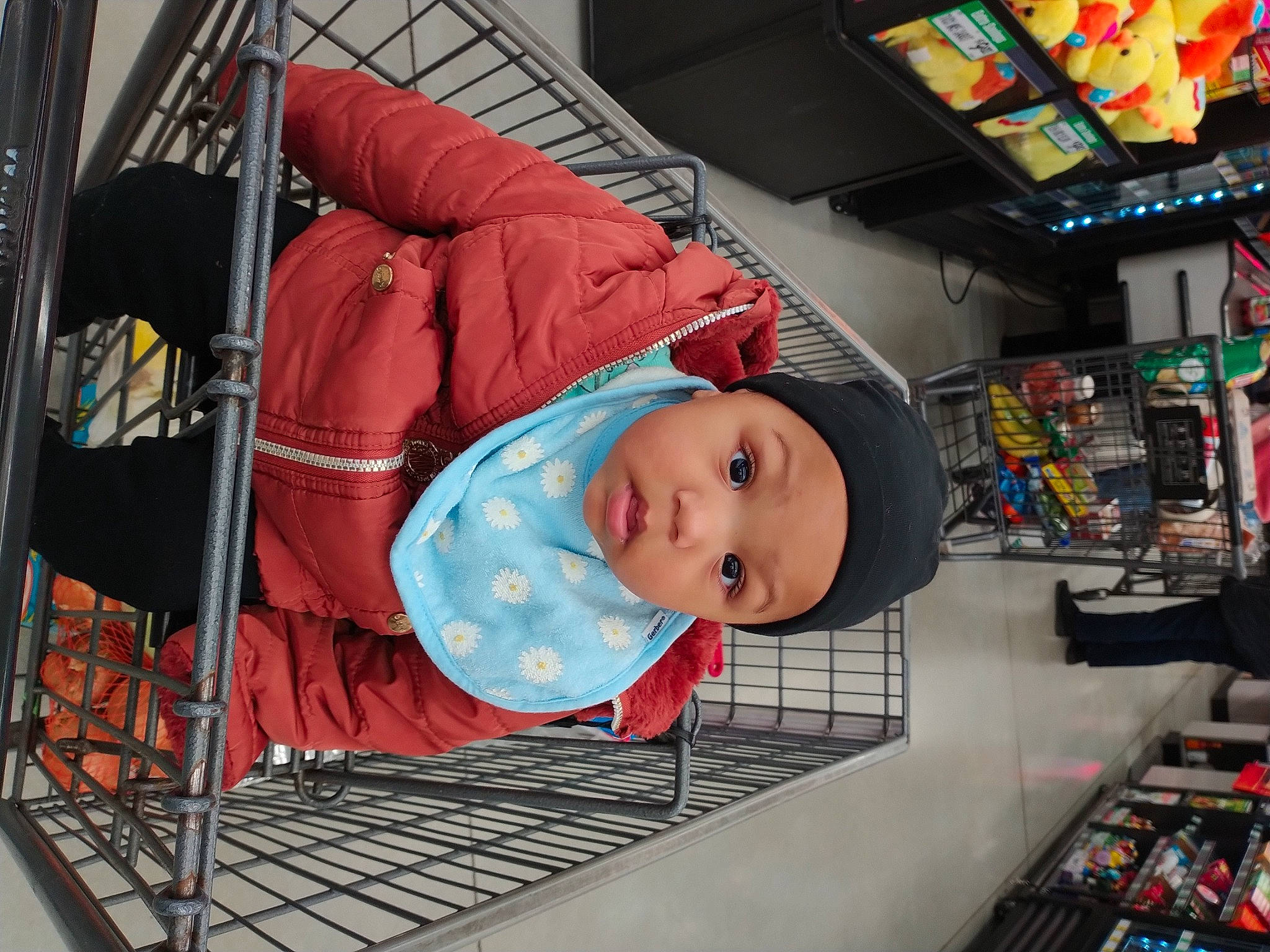 Gianna is registered to the contest to win money with this photo: baby, baby_products, child, comfort, convenience_store, flooring, fun, hat, headwear, person, product, retail, room, shelf, shelving, smile, t_shirt, toddler, transport, vacation