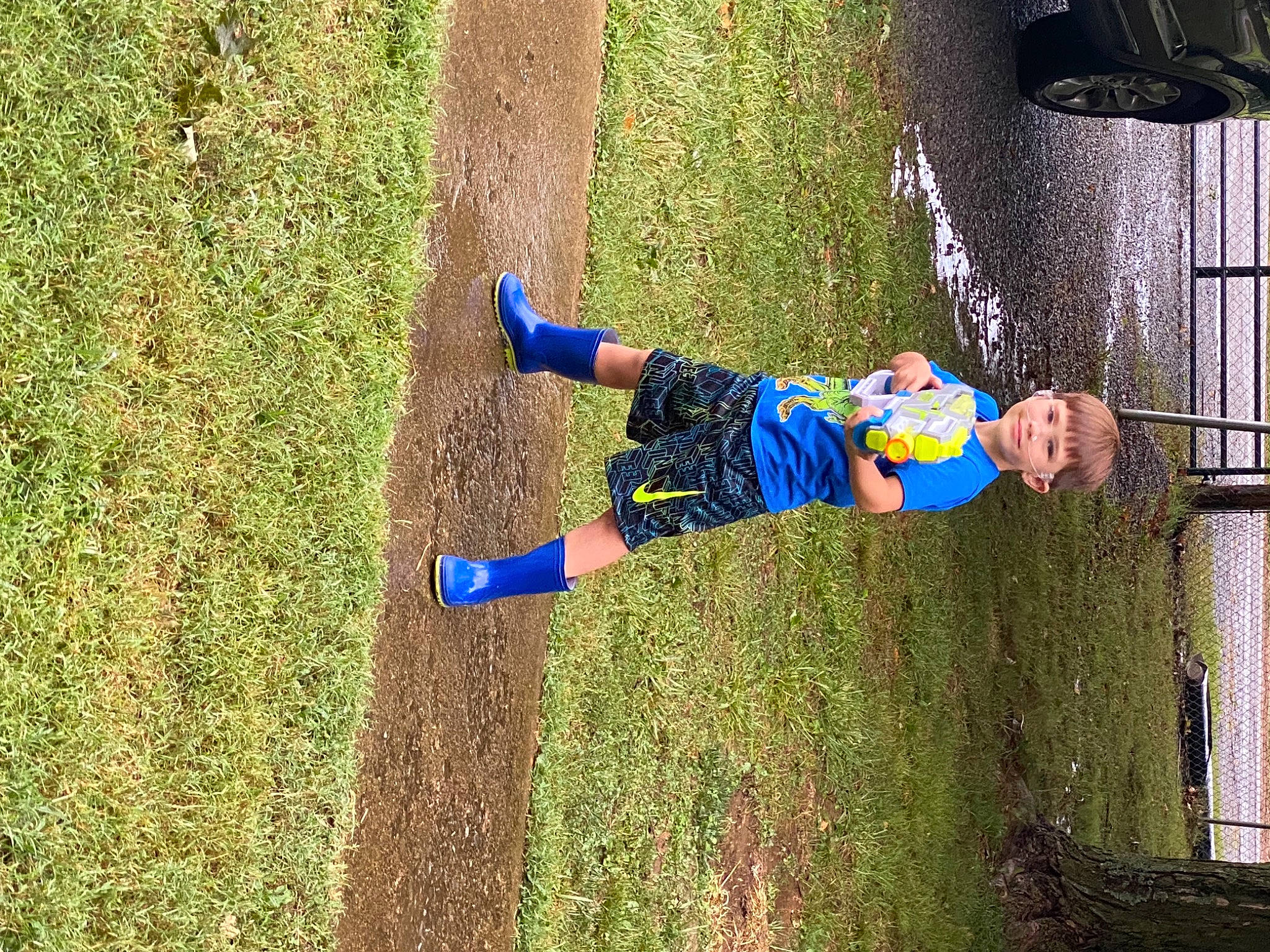 Zayne is registered to the contest to win money with this photo: electric_blue, fun, grass, joy, leisure, people_in_nature, person, plant, recreation, shadow, soil, tire, toddler, tree, trunk, walking_shoe, yard