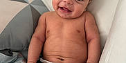Credence joined the competition — help win amazing prizes! baby, smiling, diaper, infant, cute, happy, child, skin, face, hands, legs, bed, pillow, pattern, indoor, portrait, sitting, young, candid, comfort