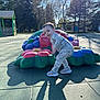 Bentley joined the competition — help win amazing prizes! toddler, child, playground, flower_sculpture, outdoor, daylight, shadow, trees, pajamas, sneakers, happy, smiling, playing, park, recreation, colorful, nature, sunlight, casual_clothing, young_child