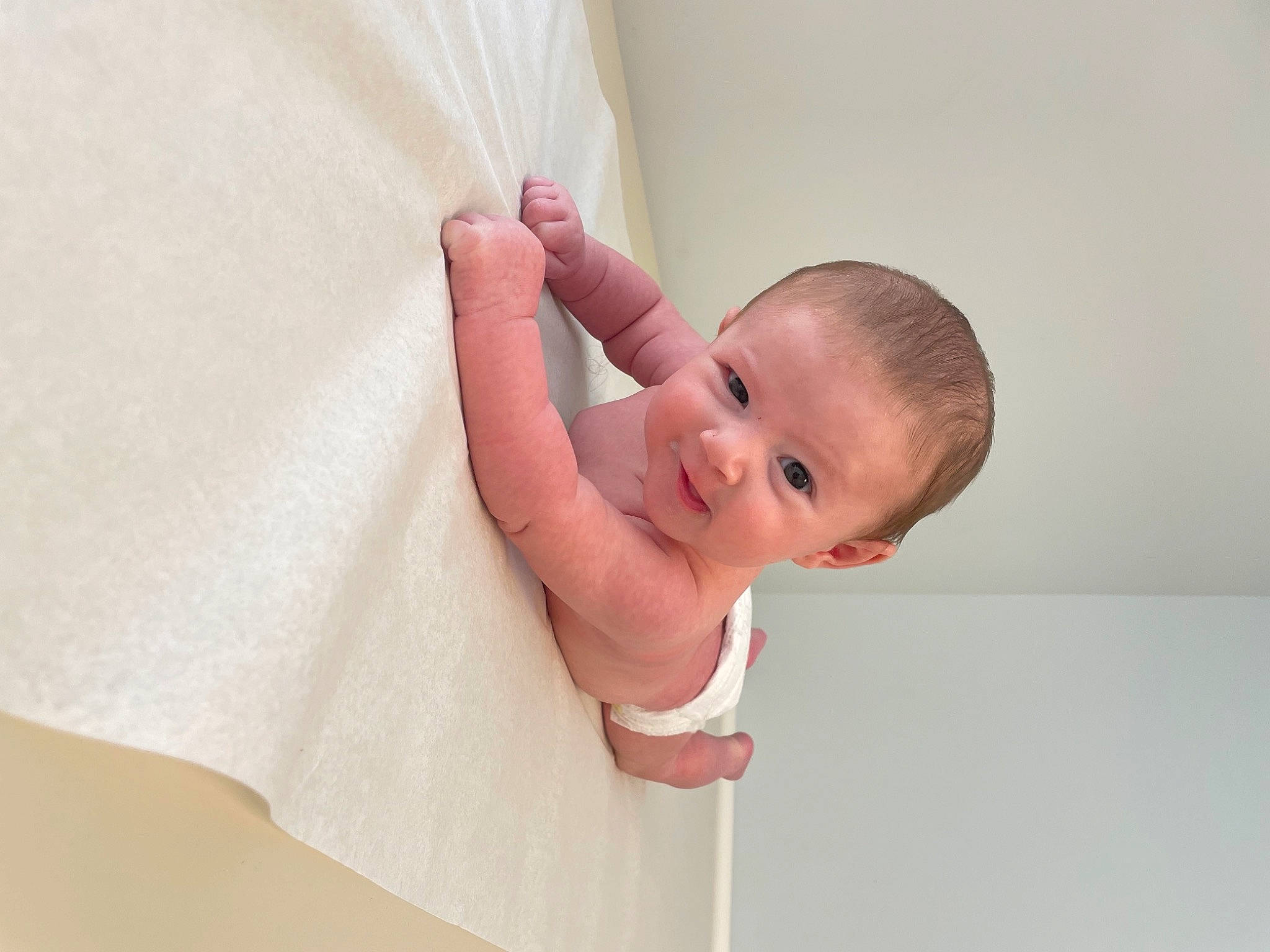 William is registered to the contest to win money with this photo: arm, baby, baby_products, baby_toddler_clothing, child, collar, comfort, elbow, finger, gesture, hand, neck, pattern, person, room, shoulder, skin, sleeve, stomach, toddler