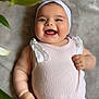 Arzugul joined the competition — help win amazing prizes! baby, smile, headband, bow, pink_outfit, chubby_cheeks, happy, lying_down, green_leaves, plant, infant, cute, portrait, ribbed_fabric, soft_surface, joyful, child, human, one_person, indoors