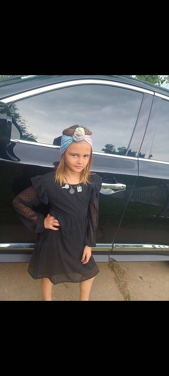 Raylee is registered to the contest to win money with this photo: automotive_design, automotive_exterior, automotive_lighting, automotive_tire, bumper, car, dress, electric_blue, flash_photography, hat, headlamp, headwear, hood, jewellery, long_hair, motor_vehicle, person, personal_luxury_car, sleeve, vehicle