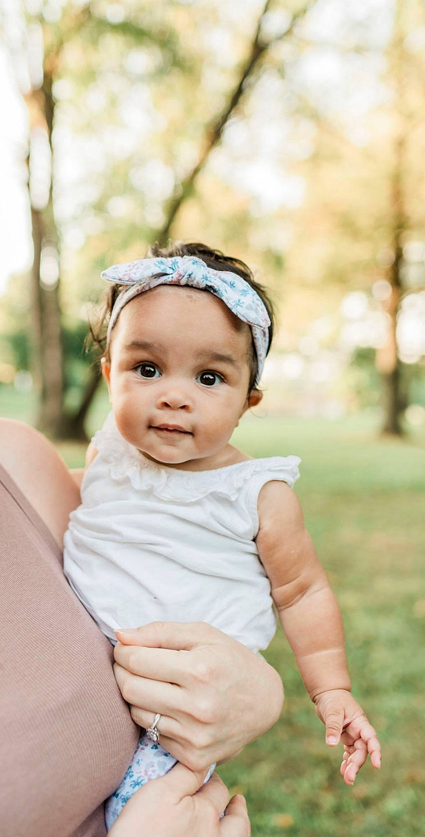 Jocelyn is registered to the contest to win money with this photo: baby, baby_toddler_clothing, child, eyelash, fashion_accessory, flash_photography, grass, hair_accessory, hand, happy, head, headband, headpiece, headwear, jewellery, person, portrait_photography, recreation, sitting, sleeve