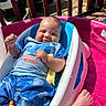 baby, infant, smiling, outdoor, pool, water, toy, giraffe, blue_clothing, whale_pattern, baby_seat, pink_pool, sunlight, fence, car, foot, happy, cute, relaxing, child