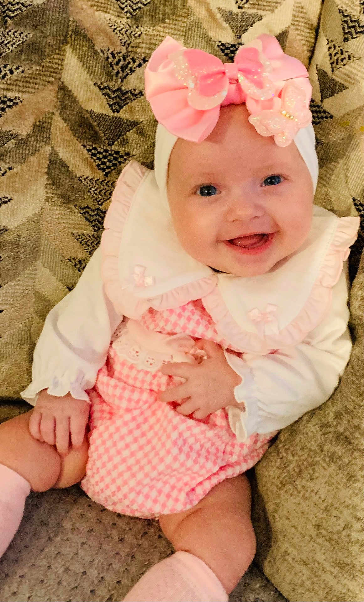 Valentina-Marie joined the competition — help win amazing prizes! baby, smiling, pink_bow, headband, pink_outfit, white_collar, sitting, couch, happy, infant, cute, child, indoors, portrait, clothing, sock, hand, face, cheerful, texture