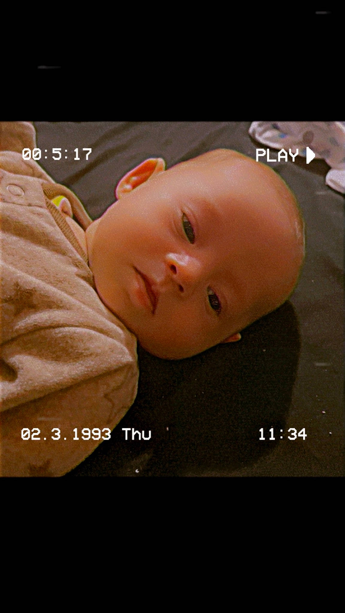 Dakota is registered to the contest to win money with this photo: baby, cheek, child, eyelash, flash_photography, font, happy, illustration, nose, person, photo_caption, portrait_photography, screenshot, sleeve, toddler, wood