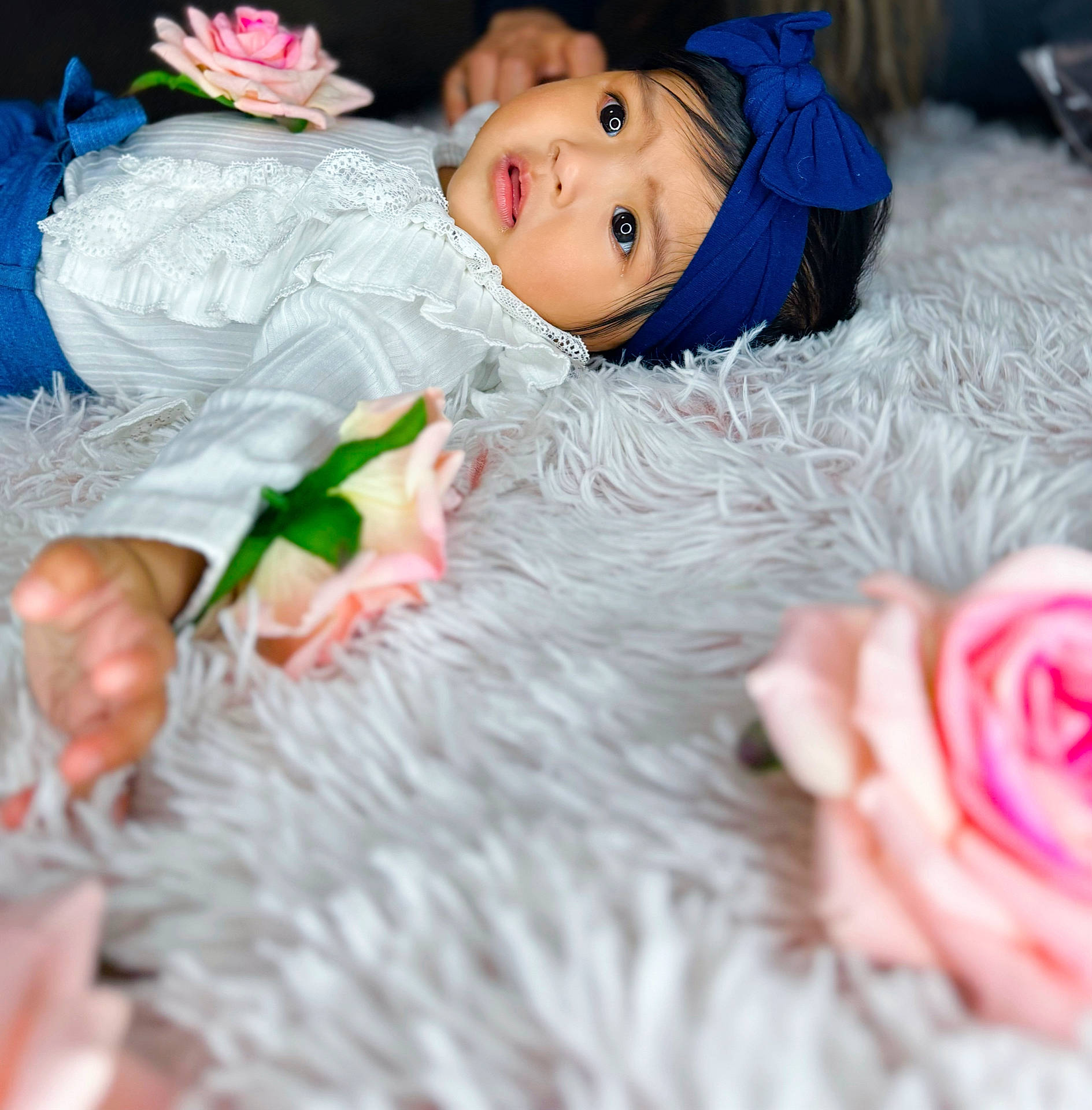 Kaileia is registered to the contest to win money with this photo: baby, bodypart, clothing, dress, face, finger, flower, flowerarrangement, flowerbouquet, formalwear, hand, happy, head, person, petal, photography, plant, portrait, rose, smile