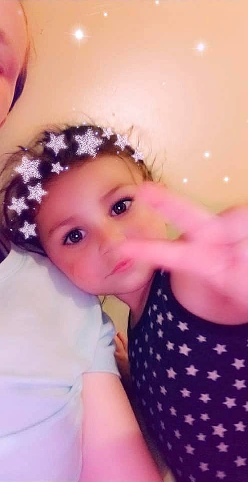 Nevaeh is registered to the contest to win money with this photo: baby_toddler_clothing, cheek, chin, eye, eyebrow, eyelash, finger, gesture, happy, head, headgear, headwear, iris, lip, mouth, neck, nose, person, pink, purple