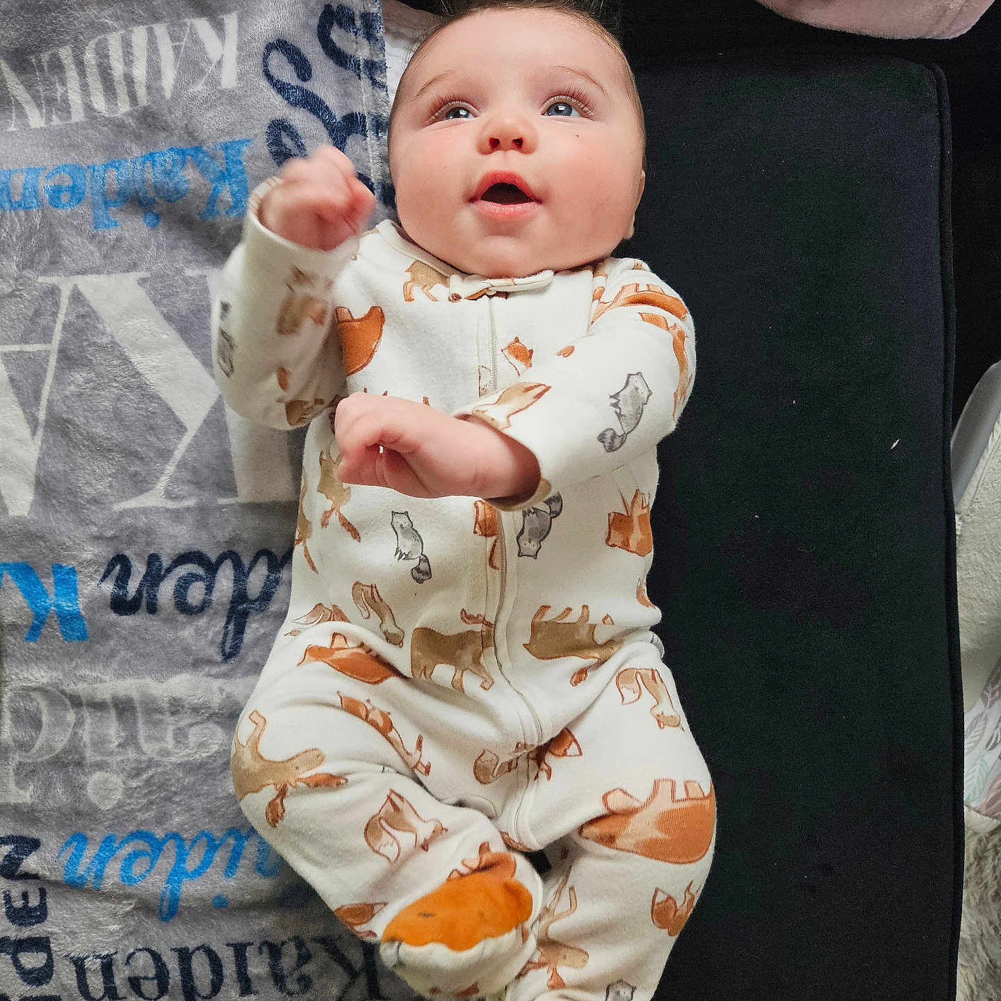 Lucas joined the competition — help win amazing prizes! baby, blanket, bodypart, clothing, face, finger, furniture, hand, head, longsleeve, newborn, pajamas, pants, person, photography, portrait, quilt, sleeve, standing, yawning
