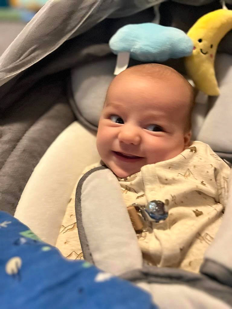 Nathan is registered to the contest to win money with this photo: baby, baby_products, cap, child, event, eye, face, fun, gesture, happy, head, human, joy, mouth, nose, person, product, skin, smile, textile