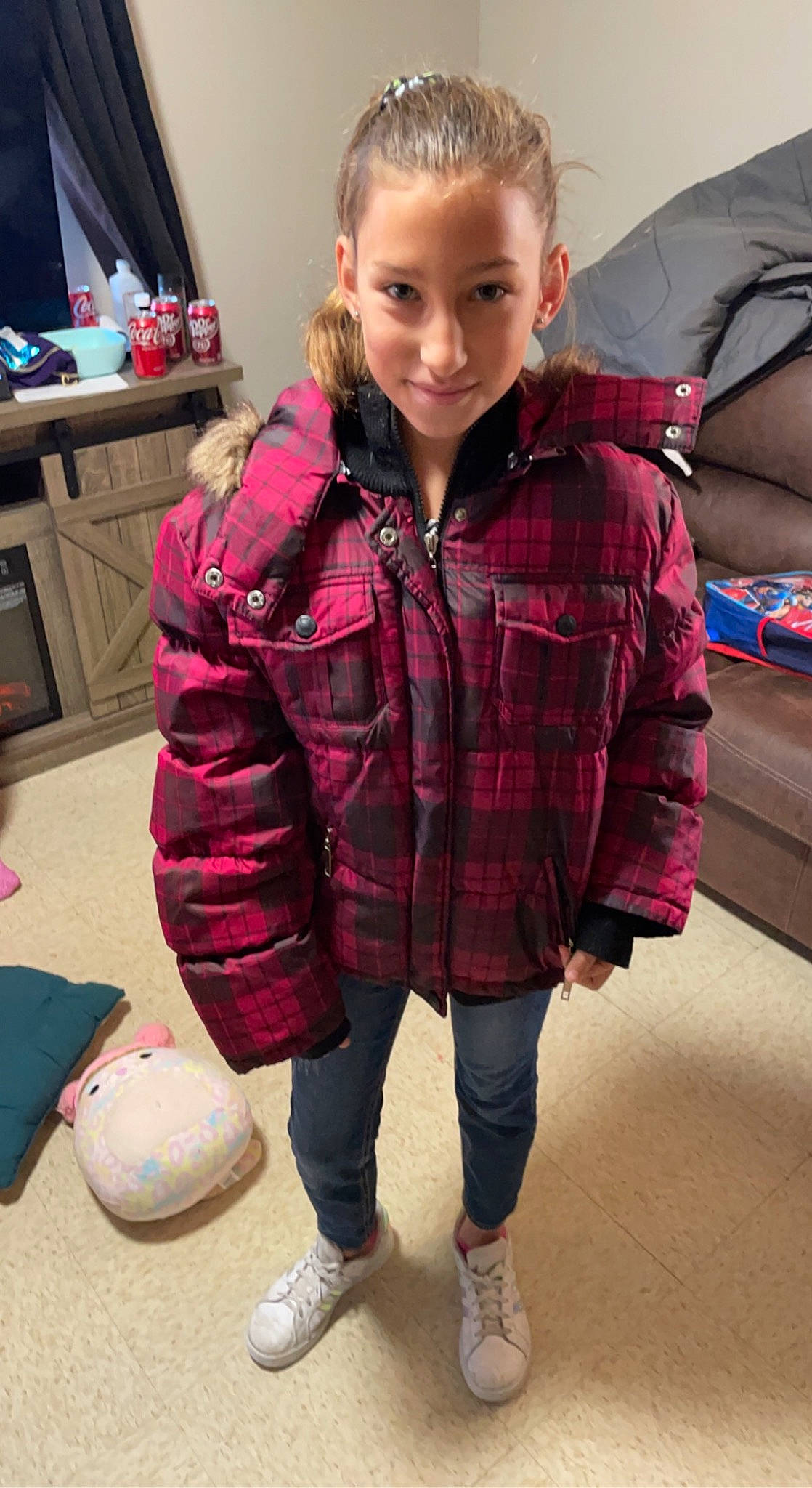 Elithyia is registered to the contest to win money with this photo: child, floor, flooring, fun, hair, hairstyle, joint, joy, knee, neck, pattern, person, pink, plaid, shoe, shoulder, sleeve, smile, sock, tartan