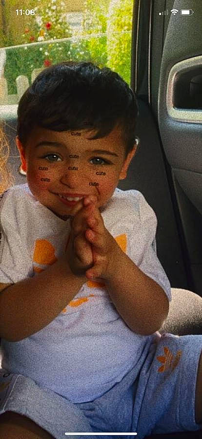Anthony is registered to the contest to win money with this photo: arm, cheek, child, chin, elbow, finger, forehead, gesture, hand, happy, lip, mouth, nose, person, skin, smile, t_shirt, thumb, toddler, vehicle_door