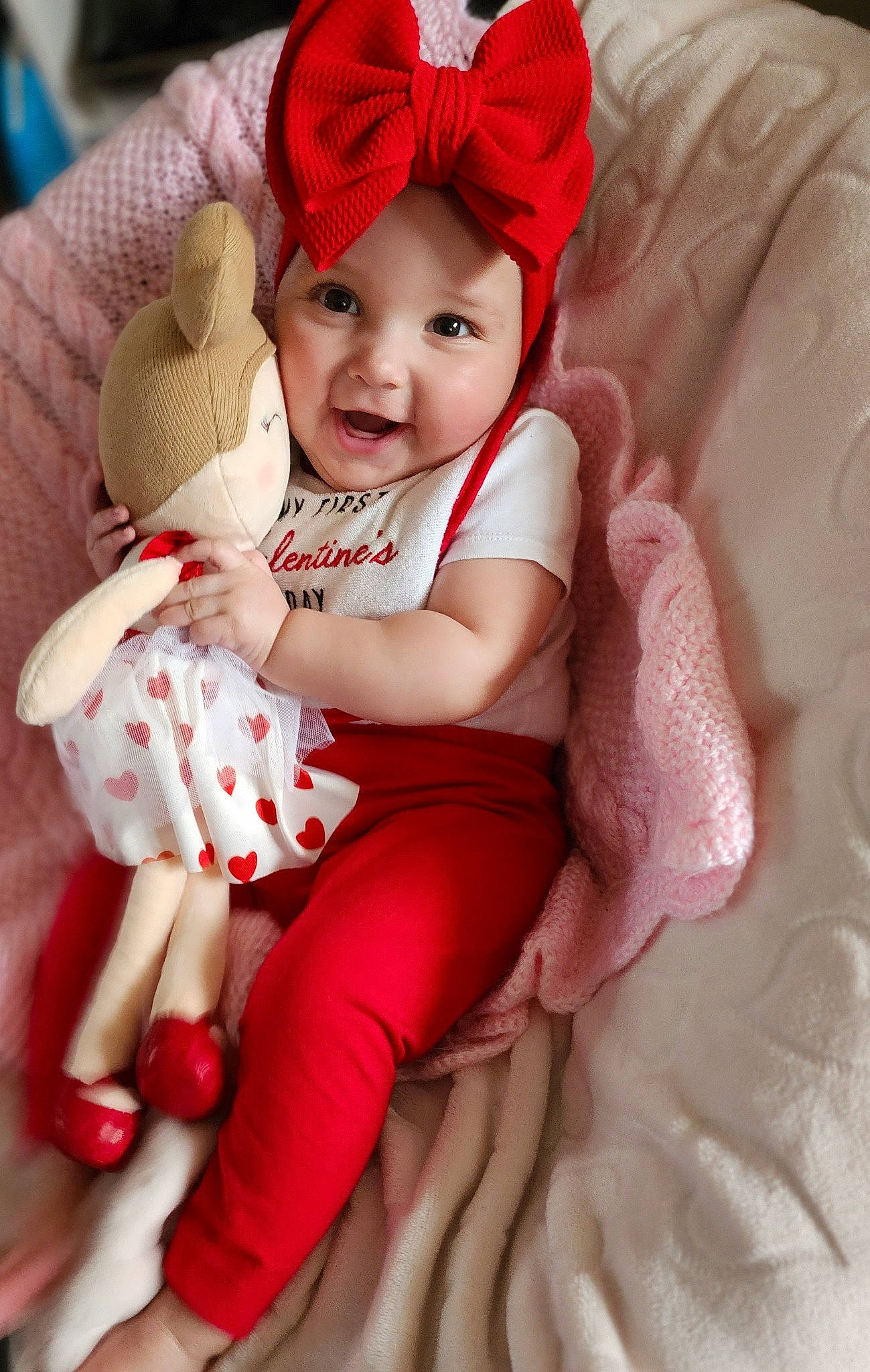Brooke is registered to the contest to win money with this photo: baby, baby_toddler_clothing, cap, cheek, child, comfort, eye, finger, happy, head, headgear, headwear, lap, person, pink, skin, sleeve, smile, sock, textile