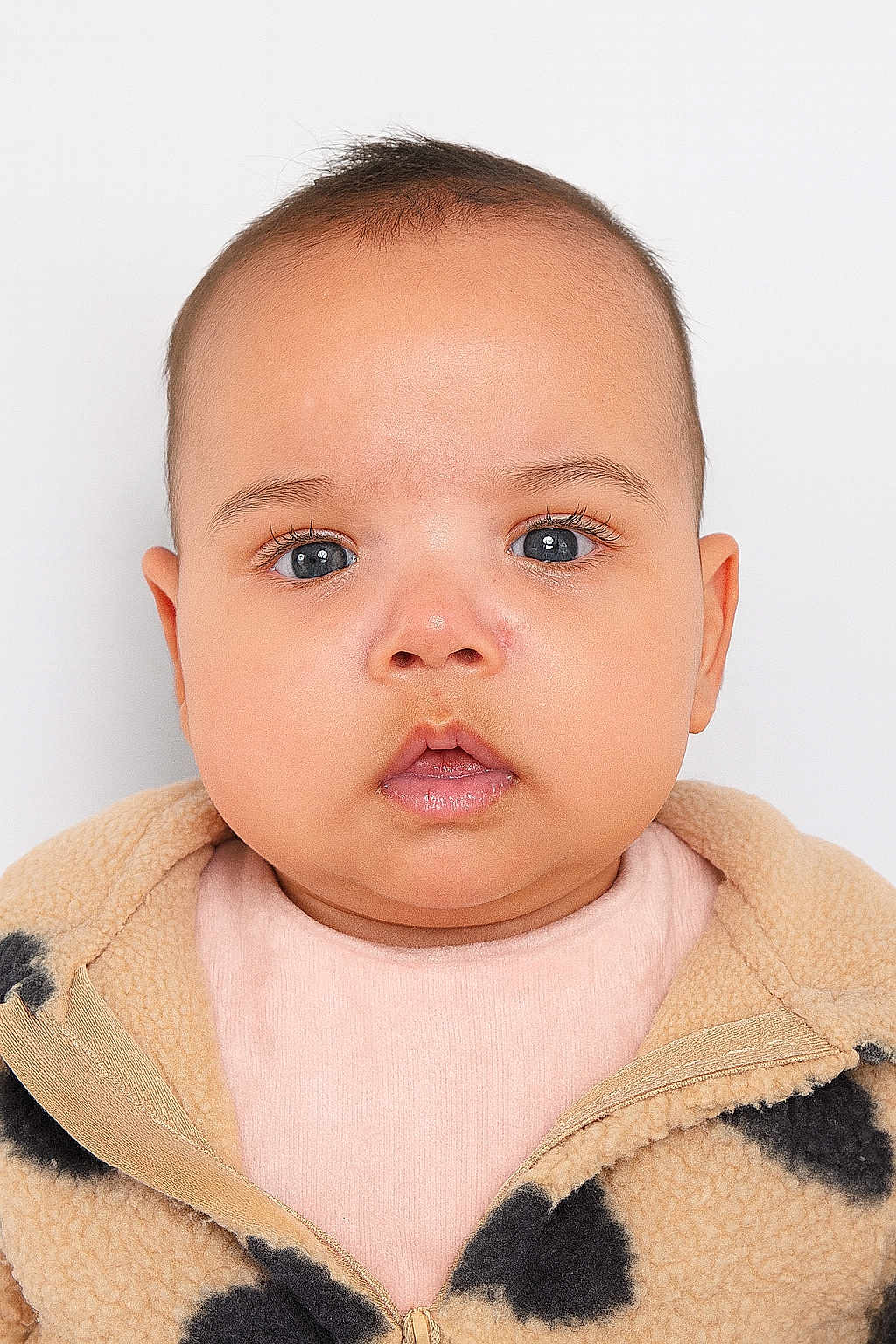 Ayline participe au concours pour gagner de l'argent avec cette photo : baby, infant, child, face, eyes, eyelashes, nose, mouth, lips, cheeks, skin, head, hair, ear, jacket, fleece, pattern, clothing, portrait, close_up