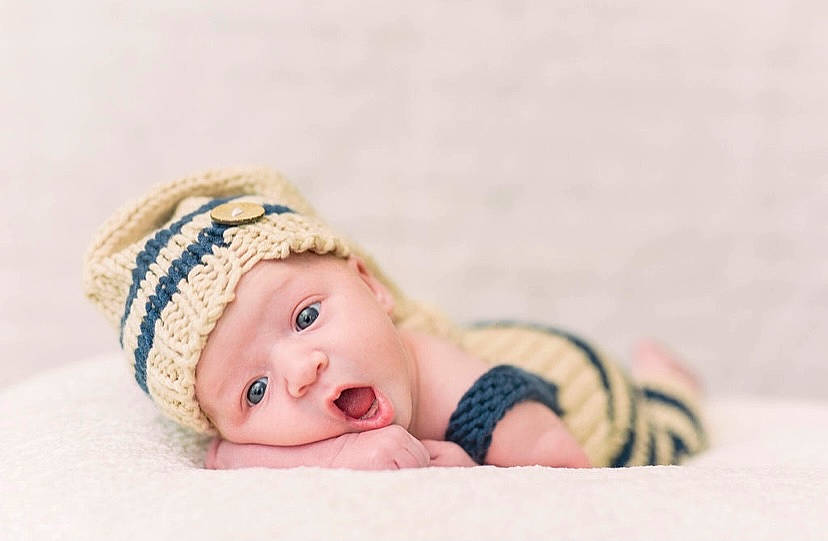 Jalen joined the competition — help win amazing prizes! baby, baby_sleeping, baby_toddler_clothing, beanie, cap, cheek, child, comfort, eye, face, fashion_accessory, flash_photography, fur, happy, hat, headwear, knit_cap, linens, person, surprise