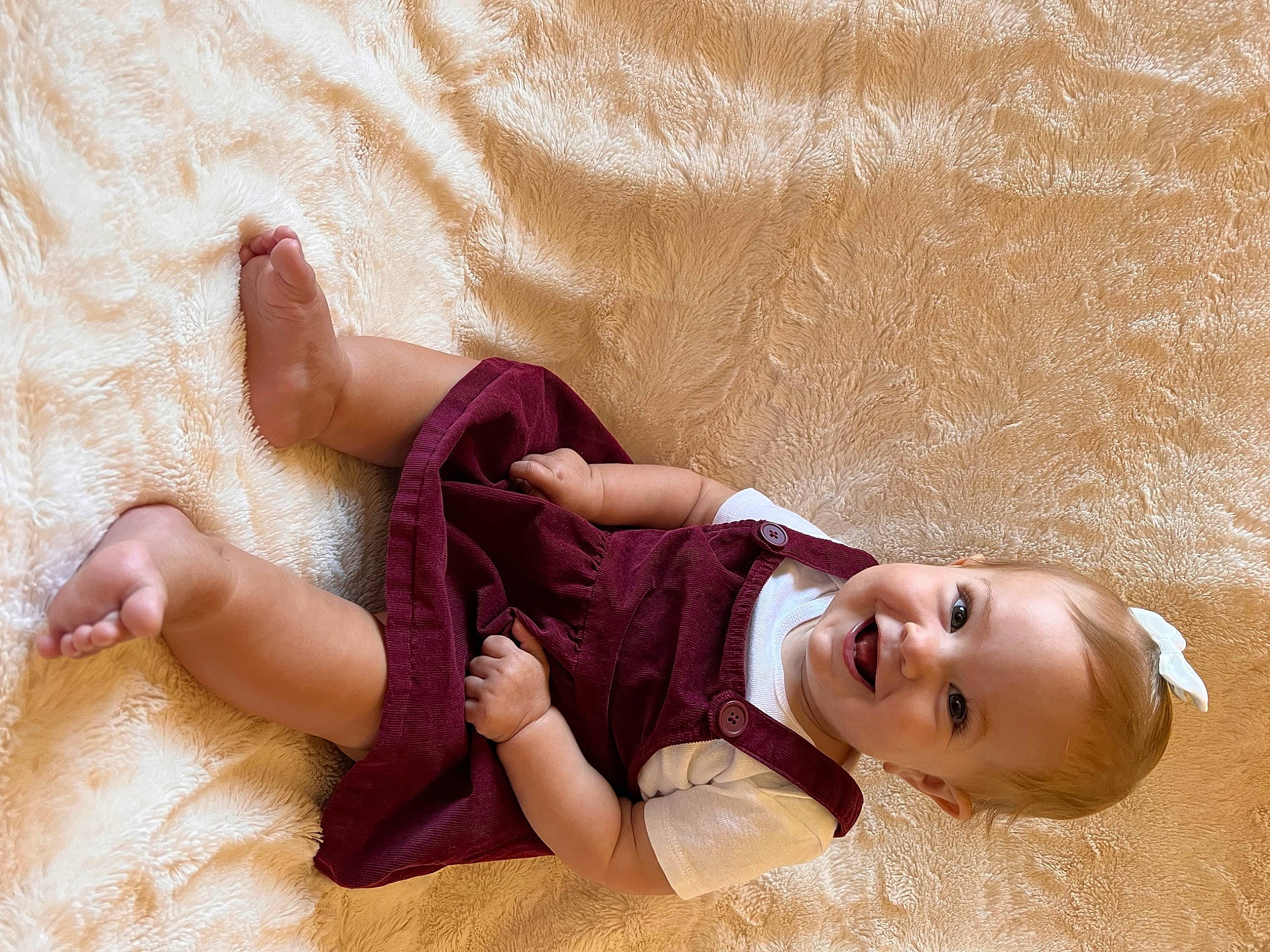 Grace is registered to the contest to win money with this photo: abdomen, arm, baby, baby_toddler_clothing, barefoot, child, comfort, foot, happy, human_leg, joy, knee, leg, person, skin, smile, sock, thigh, toddler, toe
