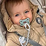 baby, infant, pacifier, stroller, jacket, hood, coat, clip, chain, strap, zipper, badge, blue_eyes, rosy_cheeks, close_up, portrait, cute, seatbelt, plush_lining, hand
