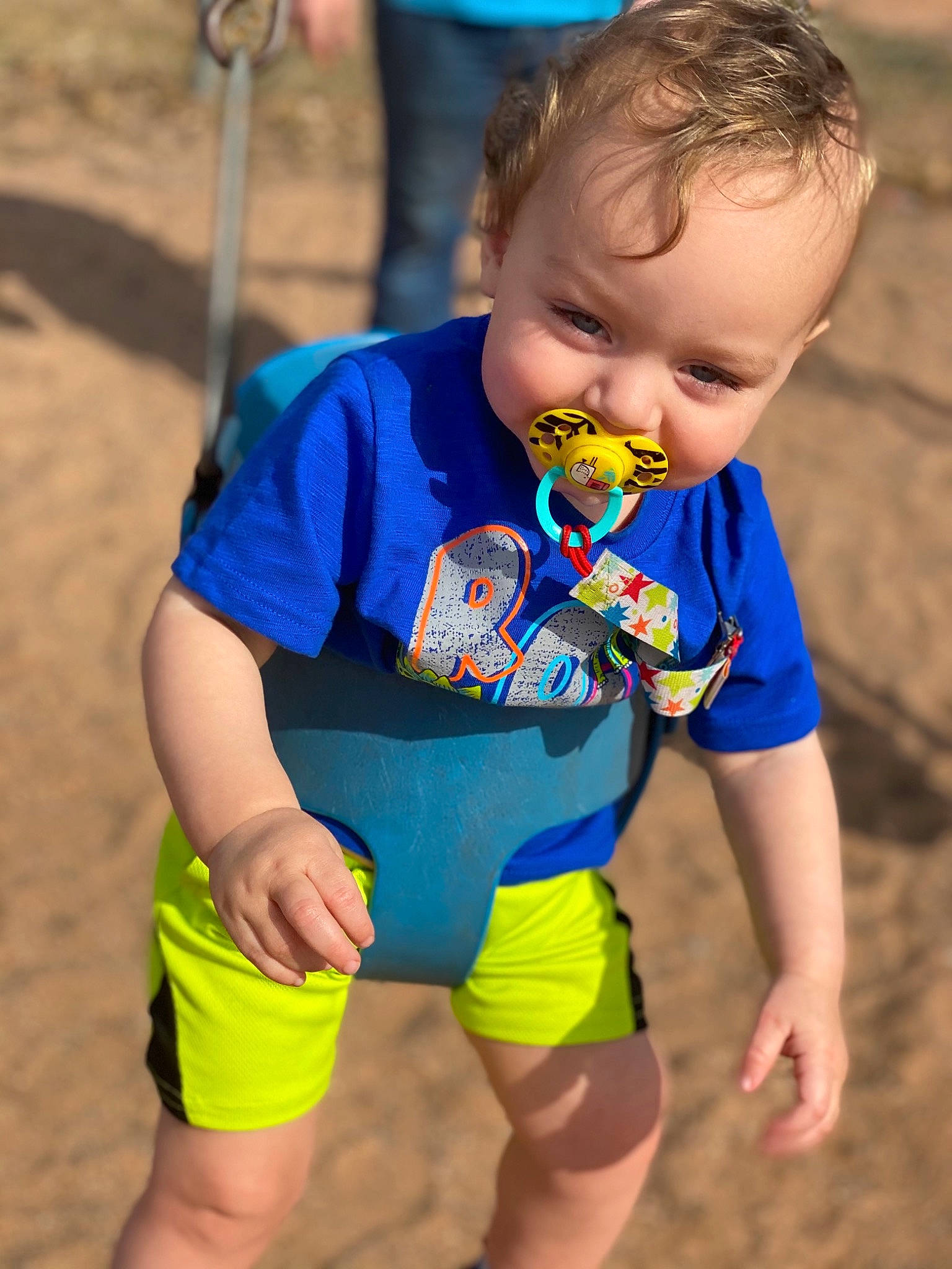 Milo is registered to the contest to win money with this photo: azure, baby_toddler_clothing, blue, face, fun, grass, hair, happy, head, iris, joint, neck, orange, person, photograph, red, shoulder, sleeve, t_shirt, toddler
