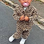 blue_eyes, casual, child, confident, cute, fashion, hair_bun, jacket, leopard_print, outdoor, pacifier, pants, person, sidewalk, standing, street, toddler, urban, white_shoes, young