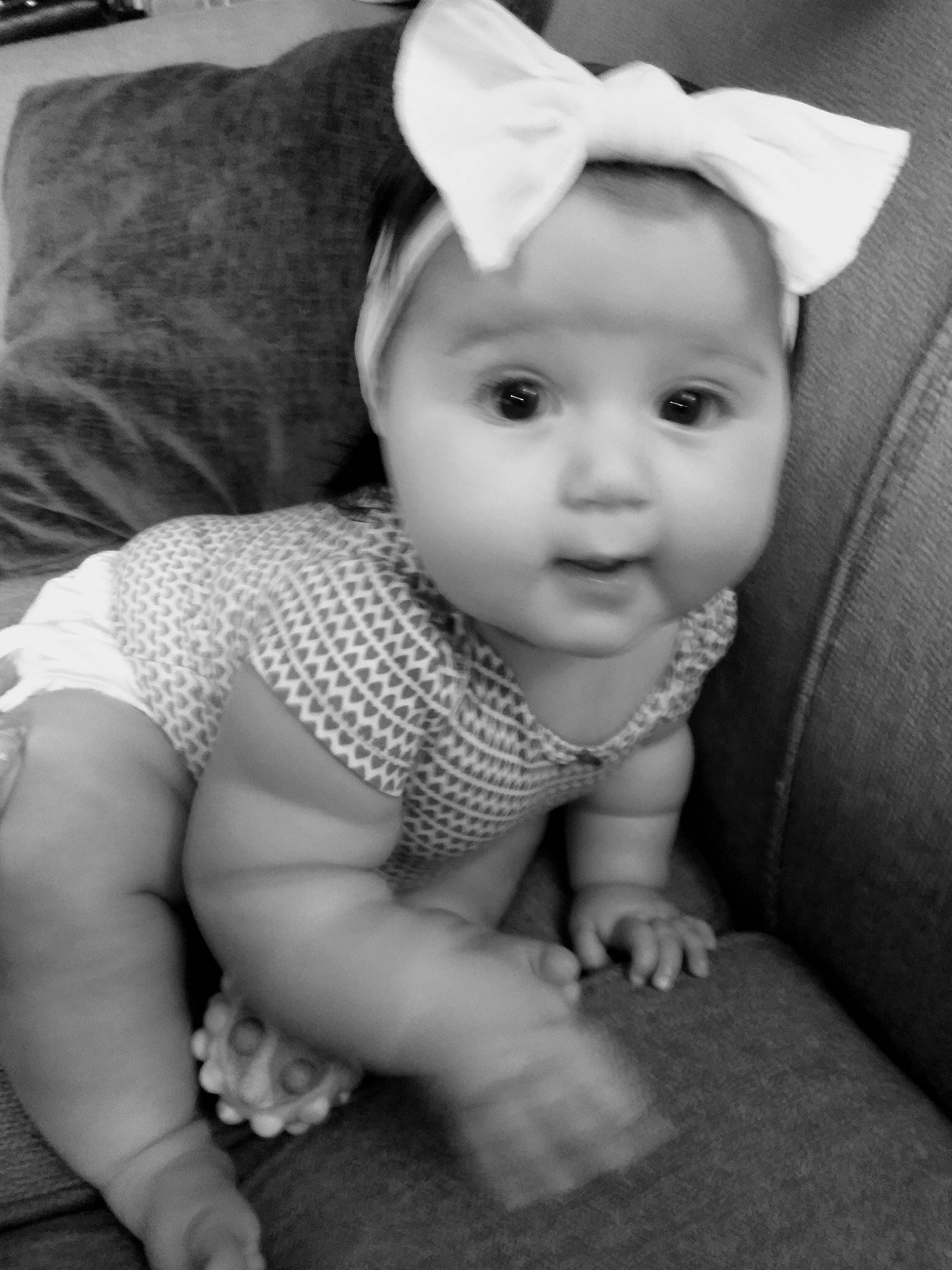 Madeline joined the competition — help win amazing prizes! baby, baby_toddler_clothing, black, black_and_white, cap, cheek, eye, eyebrow, face, flash_photography, happy, head, iris, lip, person, photograph, skin, sleeve, smile, style