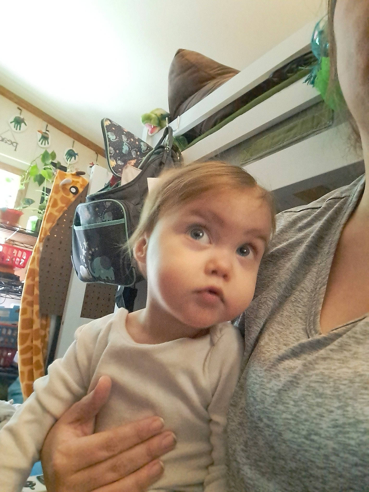 Tyra is registered to the contest to win money with this photo: baby, cheek, chest, child, comfort, ear, eyelash, fashion_accessory, fun, gesture, happy, iris, linens, person, room, selfie, sitting, surprise, t_shirt, thumb