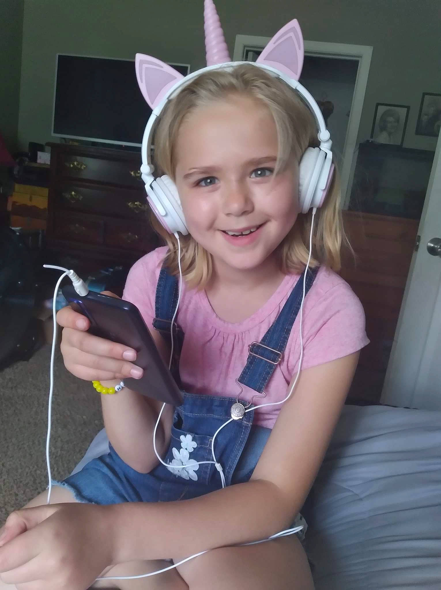 Kyleigh joined the competition — help win amazing prizes! audio_equipment, blond, child, door, ear, electronic_device, finger, fun, gadget, hairstyle, happy, head, human_leg, jewellery, joy, neck, person, personal_protective_equipment, smile, thigh