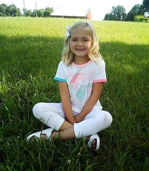 Kyleigh joined the competition — help win amazing prizes! eye, field, fun, grass, grassland, happy, head, human_leg, joy, knee, lawn, leg, meadow, natural_environment, people_in_nature, person, plant, prairie, shorts, smile