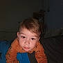 Andrés a rejoint le concours — aidez-le/la à gagner de superbes lots ! bedroom, blanket, brown_hair, child, cozy, crawling, curious, cute, dim_light, expression, face, furniture, home, indoor, long_sleeve, looking_at_camera, orange_shirt, person, toddler, young_child