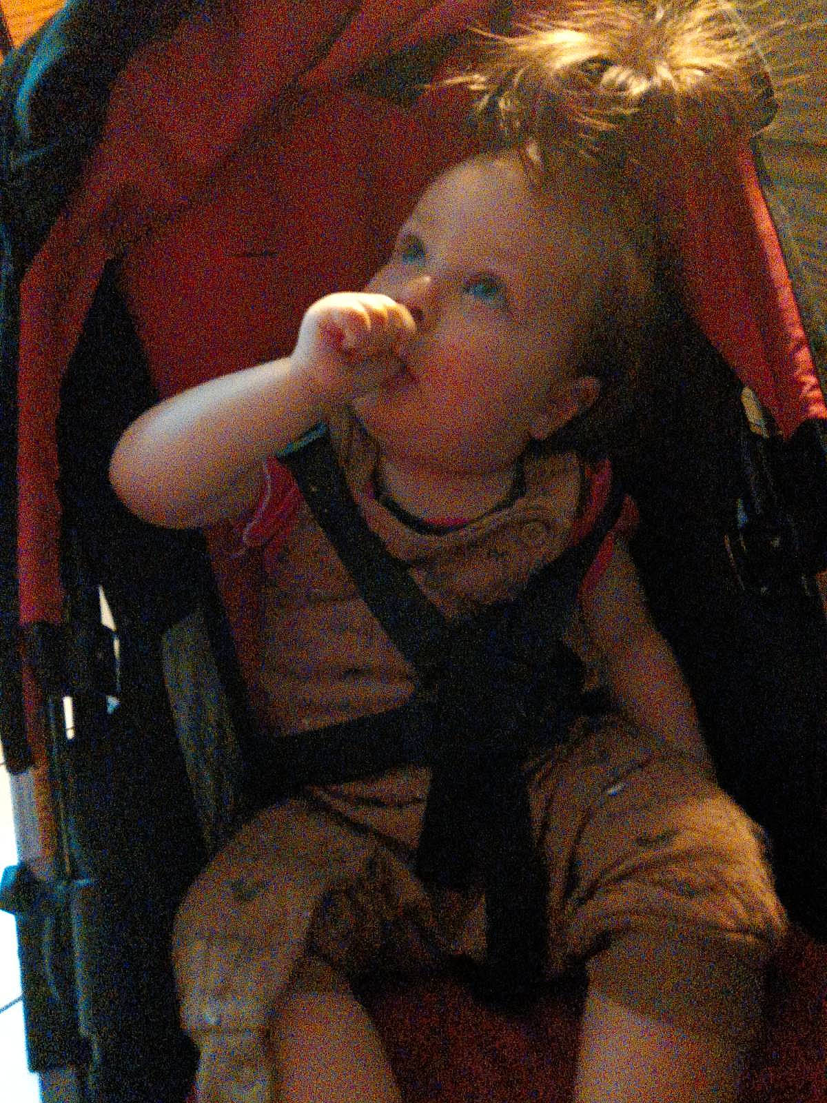 Gracie is registered to the contest to win money with this photo: baby, baby_carriage, baby_toddler_clothing, car_seat, chair, cheek, child, comfort, ear, eyelash, facial_expression, finger, fun, hairstyle, lip, mouth, nose, person, skin, thumb