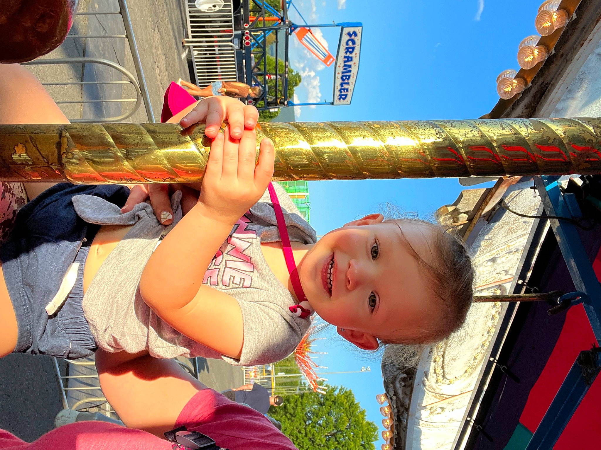 Anna joined the competition — help win amazing prizes! baby, child, city, fun, gesture, happy, joy, leisure, mouth, outdoor_play_equipment, person, playground, recreation, shorts, sky, smile, snapshot, swing, toddler, travel